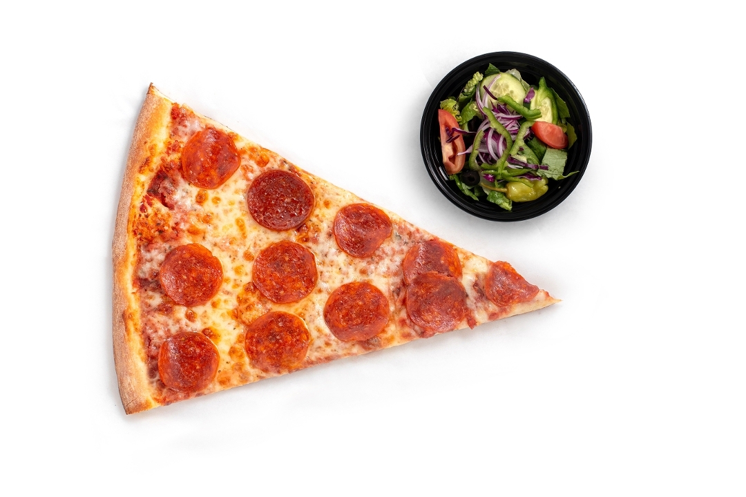Giant pizza slice with a side salad and sauce
