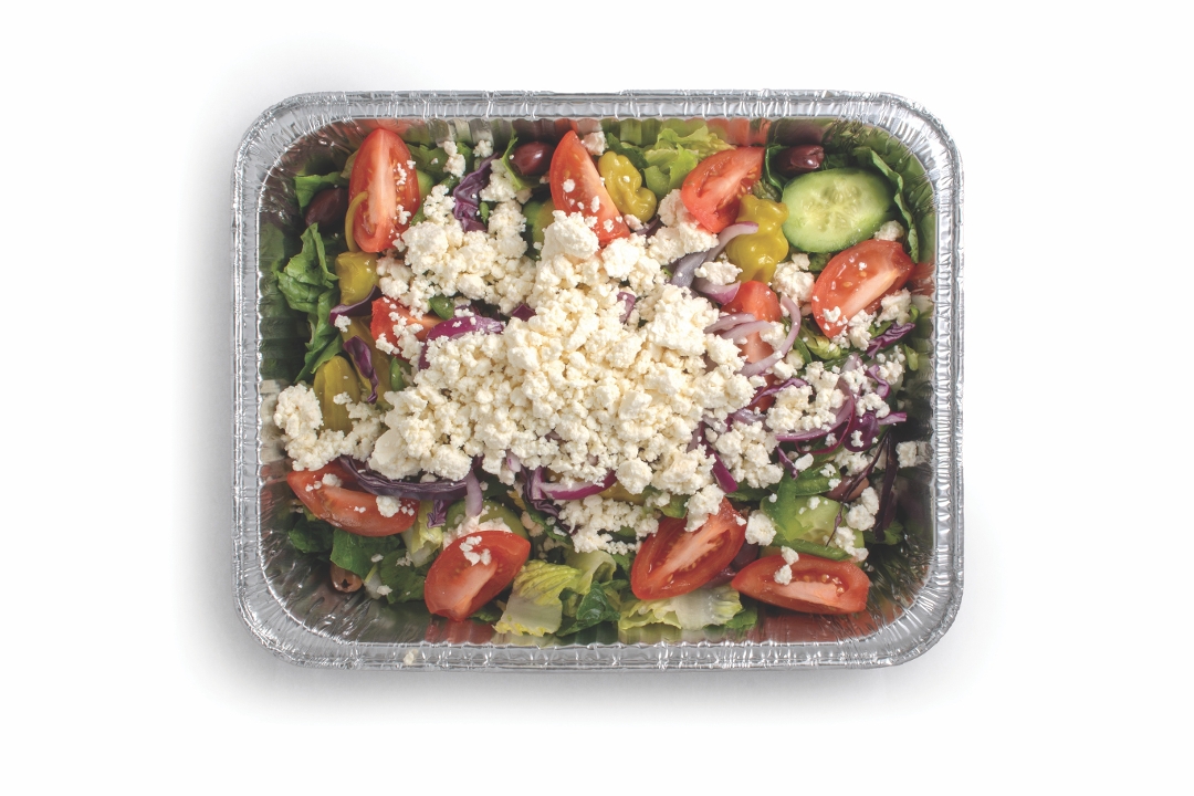 Greek salad half tray with olives, tomatoes, cucumbers, and onions